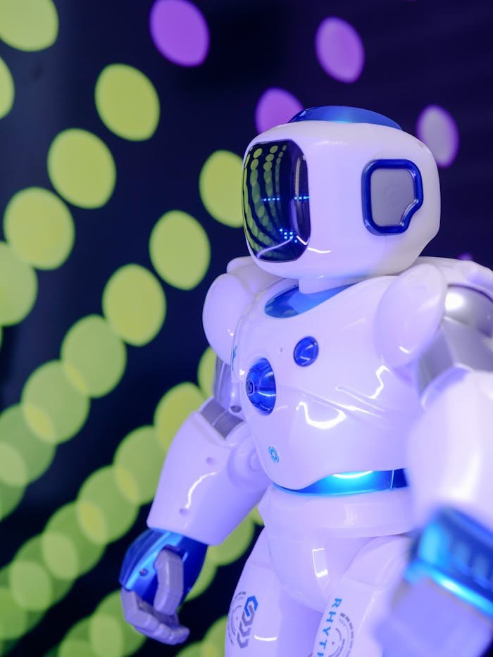 Close-up of a futuristic robot with glowing lights and a high-tech design in vibrant background.